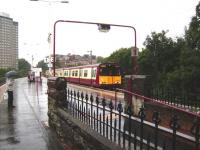 A Cathcart Inner Circle service formed by 314 211 calls at Pollokshaws East on 20 August.<br><br>[David Panton 20/08/2008]