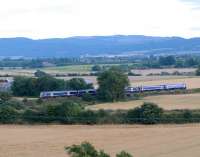 Edinburgh - Perth evening commuter service near Hilton Junction on 28 August. The steading to left is Hilton Farm and the village over the train is Bridge of Earn.<br><br>[Brian Forbes 28/08/2008]