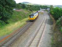 142047 in Merseyrail livery but with Northern Rail logo as well (must be the Serco NedRail connection!) slows for the stop at Chinley station on a Manchester - Sheffield stopping service on 23 August 2008.<br>
<br><br>[John McIntyre 23/08/2008]