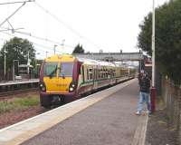 334 031 forming a Gourock - Glasgow Central service at Hillington West on 30 August. <br><br>[David Panton 30/08/2008]