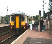 Saturday shoppers prepare to board a Whifflet - Glasgow Central train at Kirkwood on 30 August 2008, formed by DMU 156 433 <I>The Kilmarnock Edition</I>.  <br><br>[David Panton 30/08/2008]