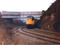 A class 27 passes under Riverside Drive between Invergowrie and Dundee in April 1979 with a train from Glasgow Queen Street.<br><br>[John McIntyre 11/04/1979]