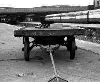 25 years after the LMS became part of the nationalised British Railways, a platform trolley still bearing the initials of the former company stands at platform 11 at the north end of Aberdeen station on 23 April 1973.<br><br>[John McIntyre 23/04/1973]