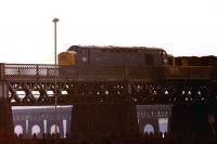 A Class 40 comes off the north end of the Tay Bridge and is about to run through the former Esplanade station with a rake of 20T mineral wagons in April 1979.<br>
<br><br>[John McIntyre 03/04/1979]