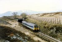 A sprinter enters the Cruach Rock Shed. This is not a true tunnel but a cutting with a cover to prevent blockage due to snow drifting.<br><br>[Ewan Crawford //1990]