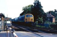 A westbound train headed by one of the Southern Region Class 74 electro-diesel locomotives approaching Brockenhurst station over the level crossing in July 1971.<br>
<br><br>[John McIntyre 19/07/1971]