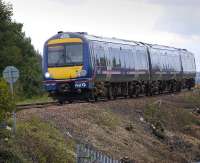 Recent vegetation clearance has opened up the lineside south of Inverkeithing as 170 457 runs downhill from Jamestown Viaduct on a Fife Circle service, on 18 September... with a cheery wave from the driver!<br><br>[Bill Roberton 18/09/2008]