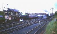 Early 1960s scene at the north end of Carstairs station with Black 5 no 45018 with empty stock alongside no 2 box and Britannia Pacific no 70017 <I>Arrow</I> about to pull away with a northbound train on the right.<br><br>[Robin Barbour Collection (Courtesy Bruce McCartney) //]