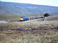 A class 45 has just run round a ballast train in Blea Moor sidings shortly after leaving Ribblehead quarry in 1984.<br><br>[Colin Alexander //1984]