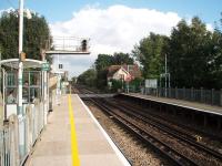 Opened in 1908, some sixty years after the line itself, Fishbourne (Halt) lies between Chichester and Bosham on the busy Portsmouth line. View eastwards over the level crossing. <br><br>[Mark Bartlett 13/09/2008]