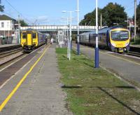 A Northern Rail service from Blackpool North to Liverpool Lime Street has just arrived at Platform 2 at Leyland on 23 September alongside a TransPennine Express service from Manchester Airport to Blackpool North at Platform 3.<br><br>[John McIntyre 23/09/2008]