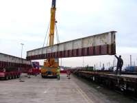 Sections of the former Merry Street bridge in the process of being transferred from road to rail at Mossend Euroterminal in preparation for their journey north to the Strathspey Railway on 3 October.<br><br>[Mick Golightly 03/10/2008]