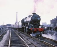 The Manchester Rail Travel Society / Severn Valley Railway Society <i>North West Tour</i> of 20th April 1968, hauled by Stanier 8F 48773, photographed during a stop at Broadfield station (closed 1970) between Bury and Rochdale. The chimney of the Unity Mill, Heywood, stands in the background.<br><br>[Robin Barbour Collection (Courtesy Bruce McCartney) 20/04/1968]
