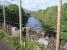 Crumbling refuge and parapet on Dochart Viaduct, now protected by a deer fence, with the view downstream towards Loch Tay. The refuges, built out slightly from the bridge, can be seen from below as in pictures 19271 and 19946. <br><br>[Mark Bartlett 29/05/2008]