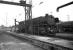 A DB class 043 2-10-0 locomotive taking water at Rheine shed in 1976 as the fireman stands beside the engine reading his newspaper. It took a while to fill up these tenders!<br>
<br>
<br><br>[John McIntyre //1976]