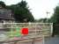 Although the Windermere branch is now operated as a <I>one engine in steam</I> siding the level crossing near Burneside station is still protected by two semaphores. View towards Burneside station, which is just round the corner, and Windermere. <br><br>[Mark Bartlett 30/08/2008]