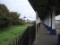 A view towards the buffers under the distinctive Falmouth Docks canopy showing one of the disused goods sidings associated with the dockyard alongside and a ship under refit beyond<br><br>[Mark Bartlett 16/09/2008]