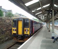 The Falmouth branch train, formed of 153382/73 waits in the bay at the west end of Truro. The down main line is signalled for both directions for the half mile from here to the branch junction.<br><br>[Mark Bartlett 16/09/2008]