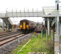 A Glasgow Central - Carlisle service pulls away from Gretna Green on 27 September with work on the extended station nearing completion.<br><br>[John Furnevel 27/09/2008]