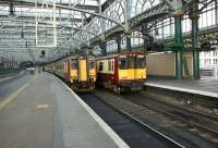 Scene at Glasgow Central on 15 October 2008, with a Class 156 being prepared for departure on a service to East Kilbride as a Class 314 EMU leaves for Gourock.<br><br>[John McIntyre 15/10/2008]
