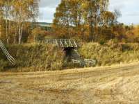 Between Grantown-on-Spey East and Nethy Bridge the trackbed is now a walkway. This timber structure supported on two metal girders replaces the original bridge over a cattle creep just south of Grantown.<br><br>[John Gray 22/10/2008]
