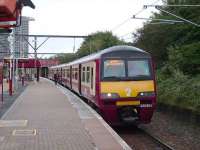 The westbound platform at Bellgrove station on 15 September 2007 with 320 304 boarding a service for Balloch.<br><br>[David Panton 15/09/2007]