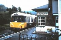 In the mid 1980s a few of the BRCW built class 104 DMUs were sent to Scotland, with one unit being repainted in a unique maroon & white livery and used on the Oban line. This unit became known as <I>The Mexican Bean</I> and is seen here at Crianlarich having arrived on a service from Oban in September 1985.<br><br>[David Panton 14/09/1985]