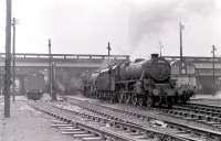 An assortment of steam and diesel on shed at Polmadie on the afternoon of 24 March 1967, including two Stanier Black 5s standing ready for their next tours of duty. Locomotive 45013, nearest the camera, subsequently took the 15.57 service to Gourock out of Central station.<br><br>[Colin Miller 24/03/1967]