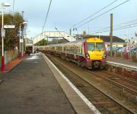 A 6-car set, with unit 334 027 leading, arrives in the western platforms at Kilwinning on 1 November 2008 with a Saturday Glasgow Central - Largs service.<br><br>[David Panton 01/11/2008]