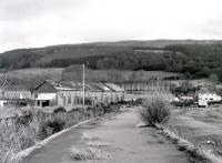 Remains of the 1882 station and shed at Fairlie Pier seen in 1985 looking back from the platforms towards the junction. The official closing date here was 31 July 1972, although the last passenger train to use the station was on 1 October 1971.<br><br>[Colin Miller //1985]