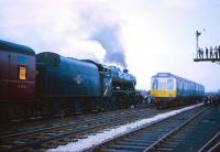 A Wigan bound DMU proceeds with caution past Stanier 8F 48773 at the head of the Manchester Rail Travel Society / Severn Valley Railway Society <i>North West Tour</i> during a photo stop at Broadfield station on the Bury - Rochdale line on 20 April 1968.<br><br>[Robin Barbour Collection (Courtesy Bruce McCartney) 20/04/1968]