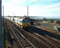 <I>So that's why they call it the West Coast Main Line.</I> 66510 and a long train of coal empties skirt Morecambe Bay while heading north at Hest Bank. The line trailing in behind the locomotive is the link from Bare Lane, now used by nuclear trains from Heysham Power Station and (from 2009) two passenger services each weekday.<br><br>[Mark Bartlett 12/11/2008]