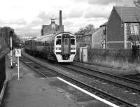 Southbound 158 910 arrives at Driffield in March 2006 with a service to Hull.<br>
<br><br>[Peter Todd 29/03/2006]