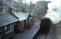 Morning commuters await the last steam - hauled train to Glasgow at Thorntonhall on the frosty morning of 15th April 1966.  Standard tank 80006 is in charge.<br><br>[G W Robin 15/04/1966]