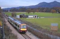 170 477 with the 1041 service to Glasgow Queen Street on 19 November passing Alloa Cricket Club with Dumyat Hill dominating the background.<br><br>[Bill Roberton 19/11/2008]