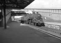 BR Standard class 5 4-6-0 no 73005 of Corkerhill shed runs into a smart looking Dalry station in July 1963 with an <I>extra</I> for Largs. [See image 29973] for the same scene forty seven years later. <br><br>[Colin Miller 19/07/1963]