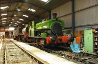 Interior shot of the Swindon & Cricklade Railway shed at Hayes Knoll on 29 November. Engines seen are Barclay 0-6-0ST <I>Salmon</I> and Hunslet 0-6-0ST <I>Gunby</I>, the latter being the precursor to the Austerity class J94, with the original design having been modified by Riddles for wartime use.<br><br>[Peter Todd 29/11/2008]