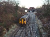 View eastwards as 156471 approaches Poulton No 3 box and station from Blackpool North. The station booking office stands on the bridge, overlooking the junction with the disused Burn Naze/Fleetwood line.<br><br>[Mark Bartlett 03/12/2008]