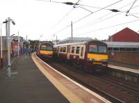 A pair of 320s pass at Partick on 30 August as reconstruction and modernisation work continues on this important west side rail/bus/Subway interchange.<br><br>[David Panton 30/08/2008]