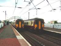 View west from the platform at Slateford on 30 July as a slightly late running 1532 for Glasgow Central passes the 1534 for Edinburgh Waverley.<br><br>[David Panton 30/07/2008]