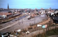 Remains of the 1847 Newcastle and North Shields Railway terminus at Tynemouth (later a goods yard), photographed in 1984, soon after the last of the track had been lifted. In the right background is the site of Tynemouth Priory, burial place of three of the Kings of Northumbria. [See image 30525] <br><br>[Colin Alexander //1984]