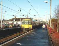 A Glasgow Central - Ayr service pulls into Kilwinning platform 4 on 10 December 2008, with 318 269 at the head of a 6-car train.<br><br>[David Panton 10/12/2008]