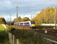 On crew familiarisation duties prior to entering service on 14 December 2008 with Northern Rail, 180103, formerly operated by First Great Western, is seen having just passed below the M6 motorway at Leyland as it approaches Euxton Junction on 1 November.<br><br>[John McIntyre 01/11/2008]