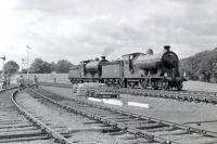 Scene at Roxburgh, the remote junction of the lines from Jedburgh and Kelso, on 9 July 1961. J37 0-6-0 no  64624 and D34 4-4-0 no 256 <I>Glen Douglas</I> are in the process of running round their train, the RCTS <I>Borders Railtour</I> from Leeds City, following a trip along the Jedburgh branch.<br>
<br><br>[Robin Barbour Collection (Courtesy Bruce McCartney) 09/07/1961]