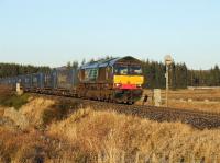DRS 66428 southbound near Moy with a train of 24 containers for Grangemouth on 30th December 2008.<br><br>[John Gray 30/12/2008]