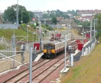 View south over Larkhall station from Raploch Street bridge in August 2006 with a train about to leave for Dalmuir. At this point the station had been open for nearly 9 months.<br><br>[John Furnevel 14/08/2006]