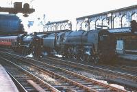 Scene at Carlisle in the mid 1960s with <I>Britannia</I> Pacific 70041 <I>Sir John Moore</I> (minus nameplates) with a train at platform 4 and Ivatt 2MT 2-6-0 no 46426 on the centre road.  <br><br>[Robin Barbour Collection (Courtesy Bruce McCartney) //]