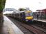 A Glasgow - Edinburgh train arrives at Falkirk High on a dull, wet, morning in August 2007.<br><br>[David Panton 18/08/2007]