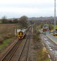 Although the station has gone the signalbox remains at Dorrington as a northbound Class 158 heads towards Shrewsbury on 19 November past an upper quadrant home signal beyond which stands a lower quadrant starter.<br><br>[John McIntyre 19/11/2008]