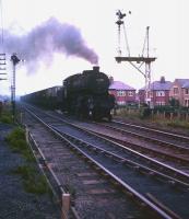 Ivatt class 4 2-6-0 no 43138 approaching Ashington with northbound coal empties in 1966, the year the locomotive arrived at North Blyth shed.<br>
<br><br>[Robin Barbour Collection (Courtesy Bruce McCartney) //1966]